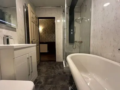 a white bathroom with a tub and a sink at The Nook Crieff - central 2-bed with garden :) in Crieff