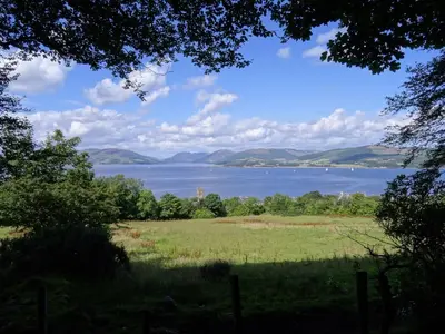 a view of a lake with mountains in the distance at The Ardyne Guest House in Rothesay