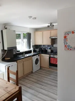 a kitchen with a washer and dryer at Urban Escape Glasgow Green Free Parking 20min walk to City Center in Glasgow