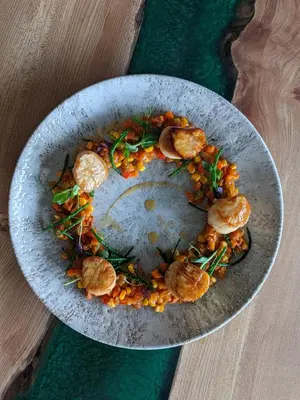 a bowl of food on a table with food in it at Isle Of Mull Hotel and Spa in Craignure