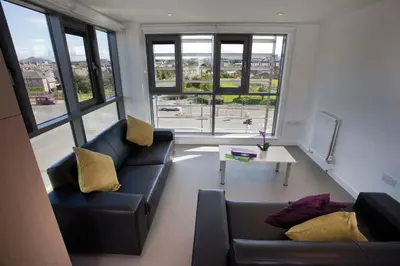 a living room with two couches and a table at Edinburgh College Residence in Edinburgh