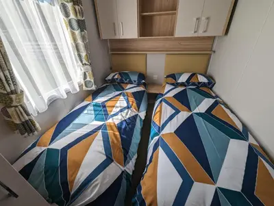 a room with two beds with ties on it at The Castleton 20 in Ardentinny