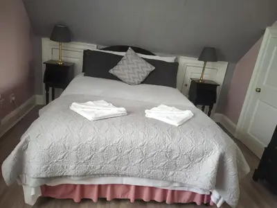 a bedroom with a bed with two towels on it at Glasgow city Charlotte service Aparments in Glasgow