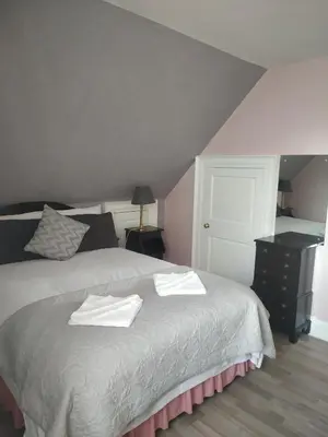 a bedroom with a bed with two towels on it at Glasgow city Charlotte service Aparments in Glasgow