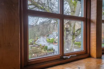 a window with a view of a street at Oak Tree Inn in Balmaha