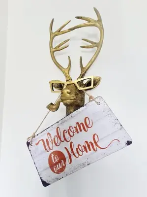 a deer with a welcome to my home sign at Spacious 5bed house, FREE parking, NO PARTY ! in Glasgow