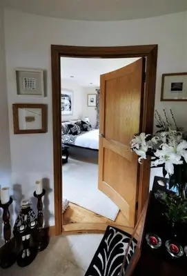 a room with a door leading to a bedroom at Loch Lomond Unique Selfcontained bed+bathroom in Alexandria