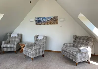 a room with two chairs and a painting on the wall at Newton Bothy in Stirling