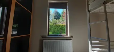 a window in a room with a radiator and a ladder at Highland Haven, Glencoe in Ballachulish