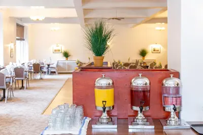 a restaurant with two drinks on a table at The Royal Hotel in Oban