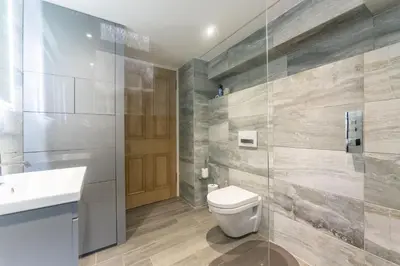 a bathroom with a toilet and a sink at The Lindsay House in Stirling