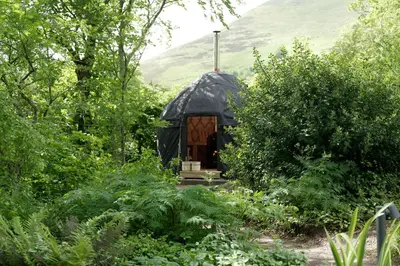 a black dome house in the middle of a garden at Eastside - Architect designed retreat with wood-fired sauna in Penicuik