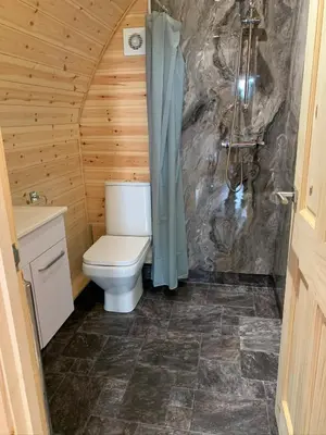 a bathroom with a toilet and a shower at Pond View Pod 3 With Private Hot Tub -Fife - Loch Leven - Lomond Hills in Kelty