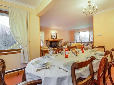 a dining room with a table and chairs at Bidean Lodge in Glencoe