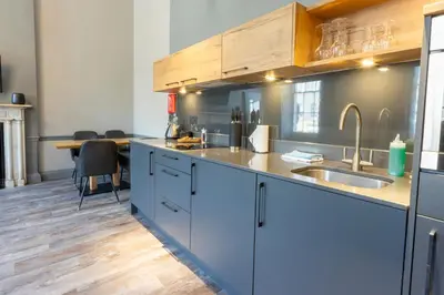a kitchen with a sink and a counter top at MONO Suites NEW TOWN in Edinburgh