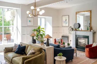 a living room with two couches and a fireplace at Grove House Hotel in Edinburgh