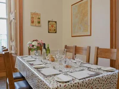 a dining room table with a table cloth on it at The Factors House - 25752 in Kilmartin
