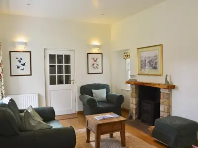 a living room with a couch and a fireplace at Westerton Lodge - Srrh in Crieff