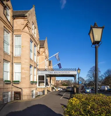 a building with a sign for the nourishing institution at Bruntsfield Hotel in Edinburgh
