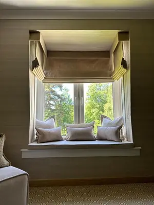 a window with pillows sitting on a window sill at Gleneagles Holiday Home Rental in Auchterarder