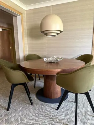 a dining room table with chairs and a lamp at Gleneagles Holiday Home Rental in Auchterarder