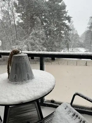 a table covered in snow with a lamp on it at Gleneagles Holiday Home Rental in Auchterarder