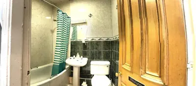 a bathroom with a toilet and a sink at Cruachan Guest House in Edinburgh