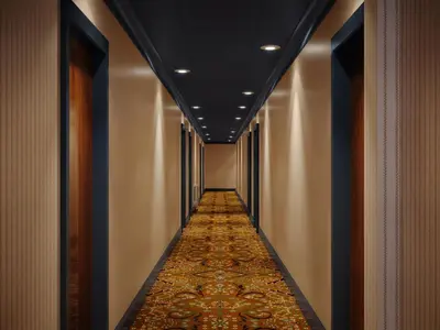 a corridor in a hotel with a carpeted hallway at Marine Troon in Troon