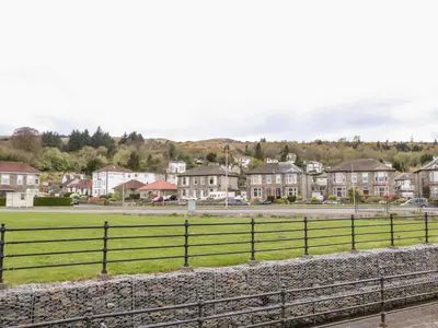 a view of a town with houses and a fence at Mars Hill Upper in Dunoon