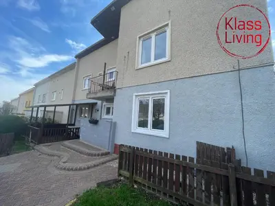 a building with a sign that says kiss living on it at Mitchell Apartment by Klass Living Coatbridge in Coatbridge