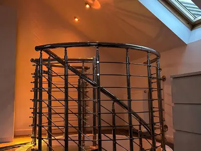 a black wire basket in a room with a window at Seaside Home in Ardeer Square