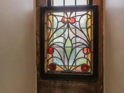 a stained glass window with cherries on it at 5 St Mary's Church in Moffat