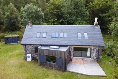 an aerial view of a house with a deck at Railway Cottage in Killin