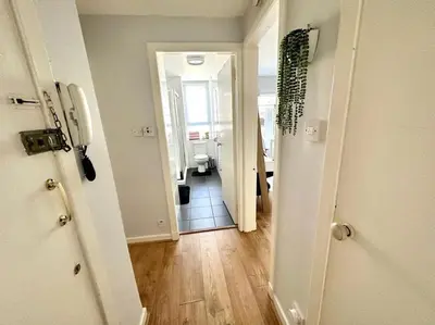 a room with a hallway with a bathroom and a room with at City Centre Hidden Hideout for 2 in Edinburgh