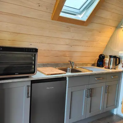 a kitchen with a sink and a microwave at Devonknowes lodges in Tillicoultry