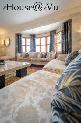 a living room with two beds and a couch at The Hoose at The Vu in Bathgate