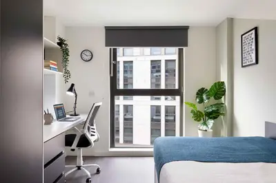 a bedroom with a bed and a desk and a window at Argyl - Westfield Summer Budget Accommodation, Adults Only in Edinburgh