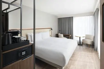 a hotel room with a bed and a television at AC Hotel by Marriott Glasgow in Glasgow