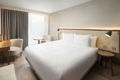 a large white bed in a hotel room at AC Hotel by Marriott Glasgow in Glasgow