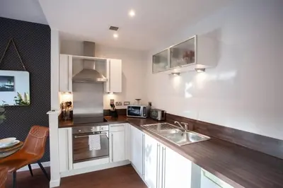 a kitchen with a sink and a counter top at 1 Bedroom Apartment in Very Central Location in Glasgow