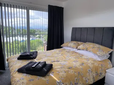 a bedroom with a bed with two towels on it at Benollis in Oban