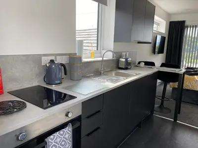 a kitchen with a sink and a counter top at Benollis in Oban
