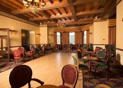 a dining room with tables and chairs in a room at Loch Awe Hotel in Dalmally