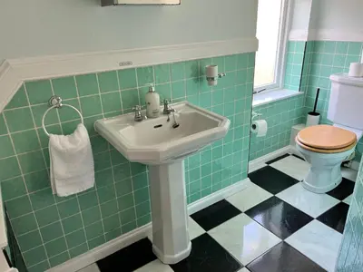 a bathroom with a sink and a toilet at Very Central, Charlotte Square, near the Castle in Edinburgh