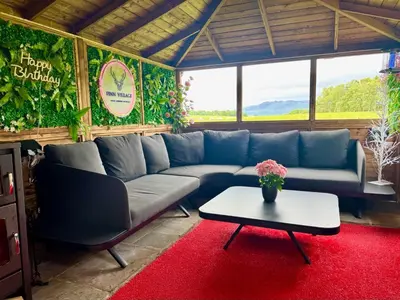 a living room with a blue couch and a table at FINN VILLAGE 