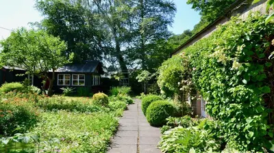 a garden path in front of a house at Glen Cottage in Comrie