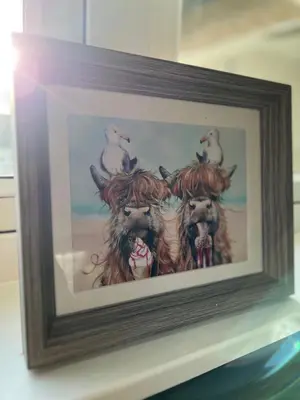 a painting of three dogs with birds on their heads at The Heilan' Coo Apartment in Helensburgh