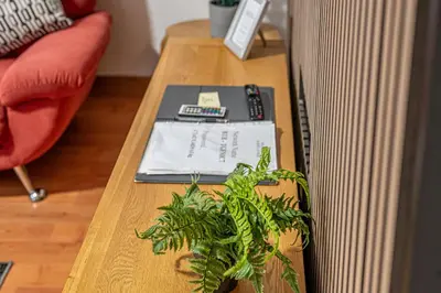 a wooden table with a plant on top of it at Super Prime Train Station Inverkeithing by TBA in Inverkeithing