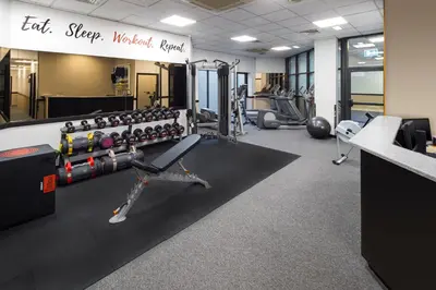 a gym with treadmills and exercise equipment at Crowne Plaza Glasgow by IHG in Glasgow