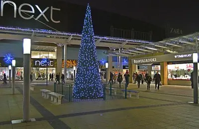 a blue christmas tree in the middle of a shopping mall at Paradise on earth in Garthamlock